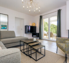 Modern living room filled with natural light and stylish decor