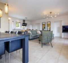 Bright and spacious open-plan living area with dining room and modern kitchen