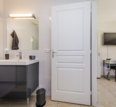Private bathrooms with towels and amenities adjoining the bedrooms