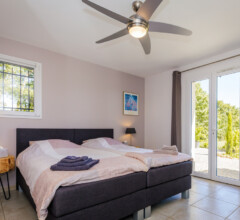 Spacious double bedroom with garden view