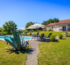 Pool and spacious terraces of the luxury Dordogne holiday rental